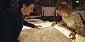 George (BEN FELDMAN) and Scarlett (PERDITA WEEKS) map their quest through miles of twisting catacombs beneath the streets of Paris in As Above/So Below.