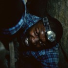 Benji (EDWIN HODGE) is trapped in the twisting catacombs beneath the streets of Paris in As Above/So Below.