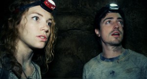 Scarlett (PERDITA WEEKS) and George (BEN FELDMAN) traverse miles of twisting catacombs beneath the streets of Paris in As Above/So Below.